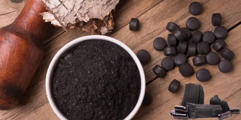 A bowl of activated charcoal with pellets, a versatile desiccant material.