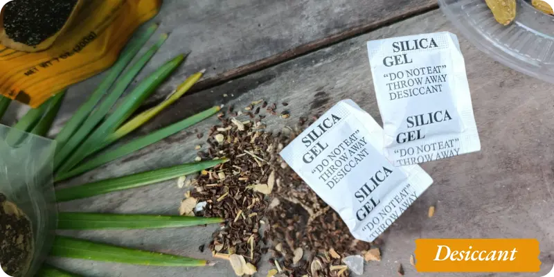 Desiccant along with seeds on a wooden Table